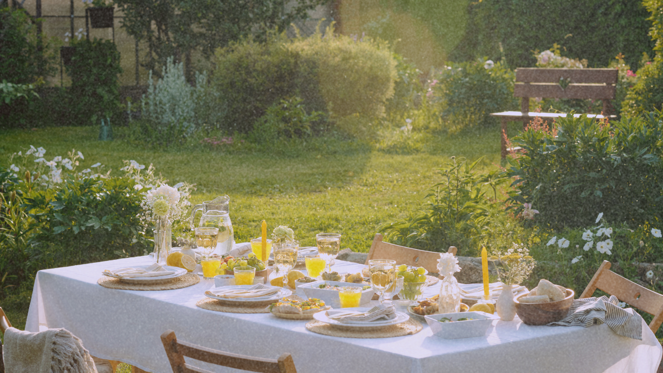 A sunlit garden table set for a golden-hour celebration